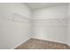 Walk-in closet with carpet flooring and metal shelving at 1773 Groveline Rd, St Cloud, FL 34771