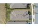 Birds-eye view of a home's roof, landscaped yard, and brick driveway at 2087 Flora Pass Pl, Kissimmee, FL 34747