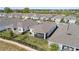 Overhead view of a home with a screened patio, lush lawn, and landscaping in a friendly neighborhood at 2087 Flora Pass Pl, Kissimmee, FL 34747
