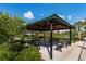 Relax at the community gazebo, complete with seating and scenic views, perfect for social gatherings at 2087 Flora Pass Pl, Kissimmee, FL 34747