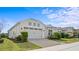 A beautiful house featuring a manicured lawn and inviting curb appeal at 2087 Flora Pass Pl, Kissimmee, FL 34747
