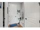 Bright foyer with a built-in bench, coat rack, and easy access to other rooms at 2087 Flora Pass Pl, Kissimmee, FL 34747