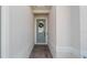 Inviting entryway with a charming blue front door and brick pathway at 2087 Flora Pass Pl, Kissimmee, FL 34747
