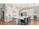 Modern kitchen featuring white cabinetry, stainless steel appliances, and quartz countertop island at 2087 Flora Pass Pl, Kissimmee, FL 34747
