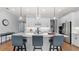 Well-lit kitchen featuring an oversized island with quartz countertops and stylish pendant lighting at 2087 Flora Pass Pl, Kissimmee, FL 34747