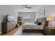 Comfortable main bedroom features a ceiling fan, nice floors and plenty of natural light at 2087 Flora Pass Pl, Kissimmee, FL 34747