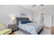 Beautiful main bedroom showcases stylish decor, wood floors, and a relaxing atmosphere at 2087 Flora Pass Pl, Kissimmee, FL 34747