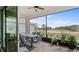 Relaxing screened patio with dining furniture and a golf course view, great for enjoying the outdoors at 2087 Flora Pass Pl, Kissimmee, FL 34747