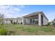 The property includes a screened lanai with a ceiling fan and outdoor seating for relaxing at 2087 Flora Pass Pl, Kissimmee, FL 34747