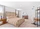 Spacious bedroom with a king-size bed, modern furniture, neutral tones, and ample natural light at 2099 Derwent Dr, Davenport, FL 33896