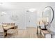 Bright hallway featuring wood floors, stylish mirror, and elegant decor at 2099 Derwent Dr, Davenport, FL 33896