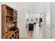 Open concept kitchen view with modern cabinetry, central island, and bright living space at 2099 Derwent Dr, Davenport, FL 33896