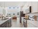Modern kitchen featuring stainless steel appliances, stylish countertops, and an open layout at 2099 Derwent Dr, Davenport, FL 33896