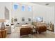 Spacious living room with high ceilings, lots of natural light, and modern furnishings at 2099 Derwent Dr, Davenport, FL 33896