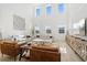 Bright living room with soaring ceilings, modern decor, and comfortable seating at 2099 Derwent Dr, Davenport, FL 33896