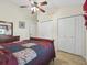 Bedroom featuring neutral walls, double closets, ceiling fan and tiled floors at 2200 Pine Needle Trl, Kissimmee, FL 34746