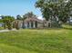 Sprawling lawn and mature trees frame this charming single-story home at 2200 Pine Needle Trl, Kissimmee, FL 34746