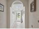Bright hallway with neutral tile floors and views of the front door at 2200 Pine Needle Trl, Kissimmee, FL 34746