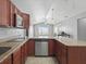 Well-equipped kitchen showcases modern appliances, and generous counter space for culinary creations at 2200 Pine Needle Trl, Kissimmee, FL 34746