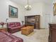 Cozy living room featuring tile floors, plush seating and an entertainment center at 2200 Pine Needle Trl, Kissimmee, FL 34746