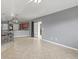 Open living space connecting the kitchen and dining area, offering seamless flow and modern design at 2200 Pine Needle Trl, Kissimmee, FL 34746