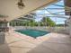 A covered pool area with a large pool cover, perfect for year-round enjoyment at 2200 Pine Needle Trl, Kissimmee, FL 34746