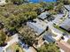 High-angle shot displaying a residential complex with neatly arranged buildings, parking, and abundant trees at 2723 Beacon St, Eustis, FL 32726
