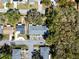 Overhead shot capturing the layout of a neighborhood with homes, parking areas, and mature trees at 2723 Beacon St, Eustis, FL 32726