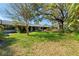 Beautiful backyard with a well-manicured lawn and mature shade trees at 2723 Beacon St, Eustis, FL 32726