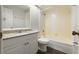 Bathroom featuring a granite countertop vanity, a toilet, mirror, and shower/tub combo at 2723 Beacon St, Eustis, FL 32726