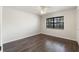Spacious bedroom featuring a ceiling fan, hard surface floors and a window at 2723 Beacon St, Eustis, FL 32726