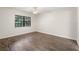 Empty bedroom showcases hard surface floors and a window with blinds at 2723 Beacon St, Eustis, FL 32726