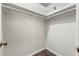Walk-in closet features hard surface floors and hanging rods for ample storage at 2723 Beacon St, Eustis, FL 32726