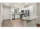 Updated kitchen with stainless steel appliances, granite counters, and bright cabinetry at 2723 Beacon St, Eustis, FL 32726