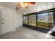 Relax in the sunroom featuring large windows and a ceiling fan at 2723 Beacon St, Eustis, FL 32726