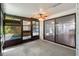 Enclosed sunroom with screened windows and access to the living room at 2723 Beacon St, Eustis, FL 32726