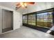 Relax in the sunroom featuring large windows and a ceiling fan at 2723 Beacon St, Eustis, FL 32726