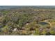 Aerial view captures property's lush greenery, tranquil pond, and prime location at 275 Clearview Rd, Chuluota, FL 32766