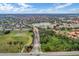 Panoramic aerial showcasing the expansive resort community with pool, green spaces, and serene lake views at 2784 Almaton Loop # 301, Kissimmee, FL 34747