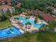 Panoramic aerial shot showcasing the luxurious resort-style pool and community amenities at 2784 Almaton Loop # 301, Kissimmee, FL 34747