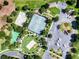 Aerial view of the community recreational area featuring tennis and basketball courts, pool and playground facilities at 2784 Almaton Loop # 301, Kissimmee, FL 34747