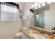 Bathroom with a granite vanity, white fixtures, and Mickey Mouse decor at 2784 Almaton Loop # 301, Kissimmee, FL 34747