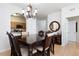 Traditional dining room with hardwood floors, chandelier, and access to the kitchen at 2784 Almaton Loop # 301, Kissimmee, FL 34747