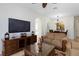 Bright living area offering sofas, entertainment center, and access to other rooms at 2784 Almaton Loop # 301, Kissimmee, FL 34747