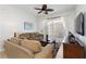 Inviting living room featuring neutral tones, comfortable seating, and access to outdoor balcony at 2784 Almaton Loop # 301, Kissimmee, FL 34747