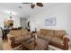 Open-concept living area with plush sofas, dining area, and view to modern kitchen at 2784 Almaton Loop # 301, Kissimmee, FL 34747