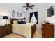 Comfortable main bedroom features a ceiling fan, window with curtains, and stylish decor at 2784 Almaton Loop # 301, Kissimmee, FL 34747