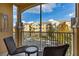 Outdoor screened patio with chairs offering a scenic view of the neighborhood at 2784 Almaton Loop # 301, Kissimmee, FL 34747