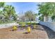 Community playground featuring four bright yellow see-saws in a mulch filled play area with surrounding mature trees at 2784 Almaton Loop # 301, Kissimmee, FL 34747