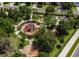 An aerial view of a playground with swing set, castle and various play structures at 2784 Almaton Loop # 301, Kissimmee, FL 34747